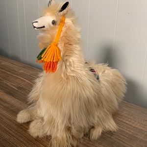 Cute sitting  Large alpaca with baby alpaca fiber.